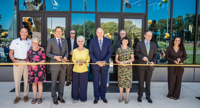 Group of ORU staff posing for the ribbon cutting 